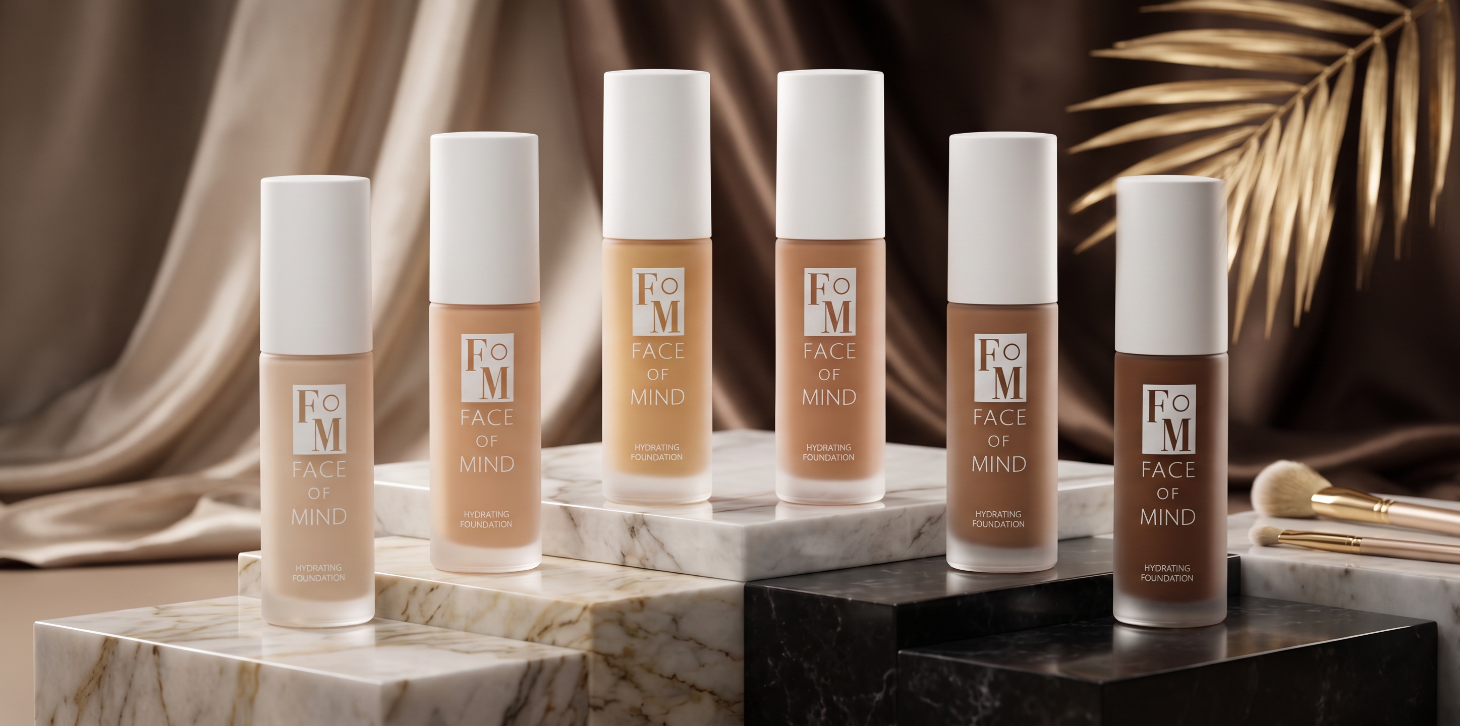 The six Face of Mind hydrating foundation shades on a marble ledge